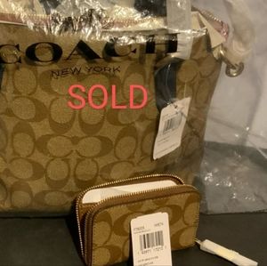 COACH Signature crossbody and zip around coin case.